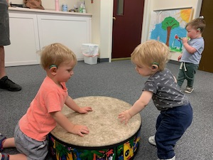 Girls playing instruments in the Music Together within Therapy program