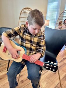 Eli with a guitar